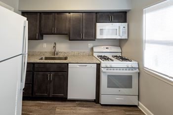 Kitchen with large window at McDonogh Village Apartments & Townhomes, Randallstown, Maryland